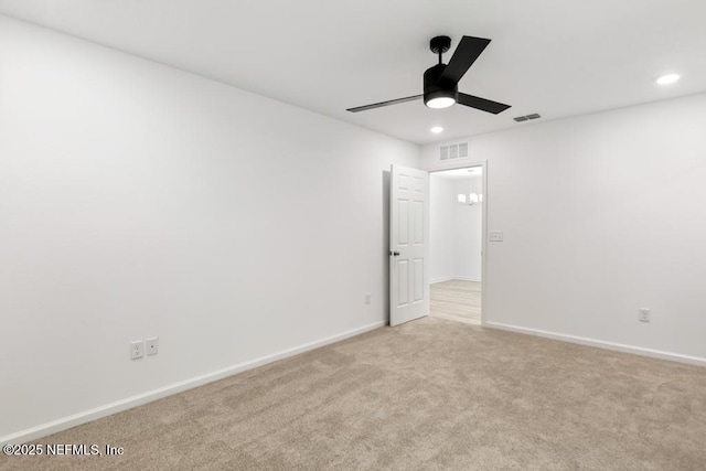 unfurnished bedroom featuring recessed lighting, light carpet, visible vents, and baseboards