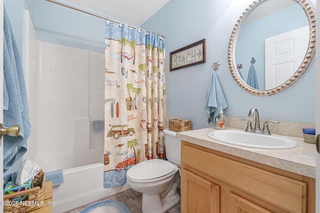 bathroom featuring shower / bath combo with shower curtain, toilet, and vanity