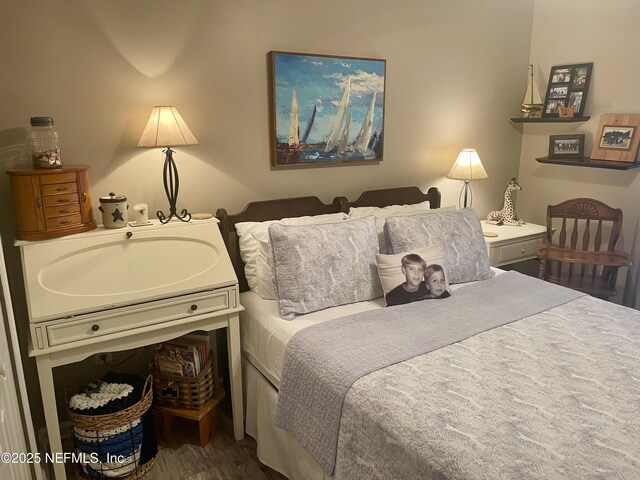 bedroom featuring wood finished floors