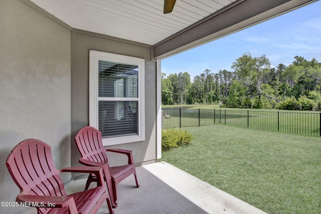 exterior space with ceiling fan and a fenced backyard