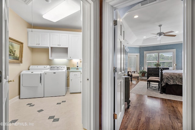 clothes washing area with cabinet space, separate washer and dryer, a ceiling fan, baseboards, and recessed lighting