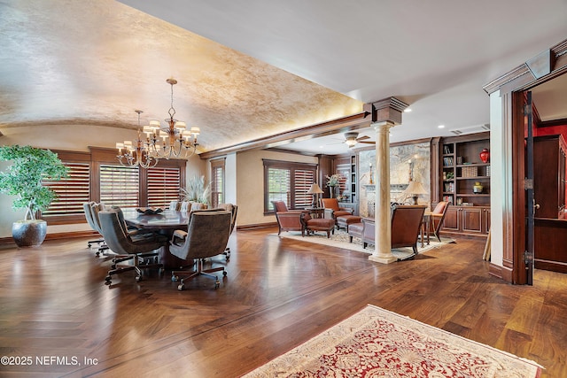 dining area featuring decorative columns, a chandelier, baseboards, ceiling fan, and lofted ceiling