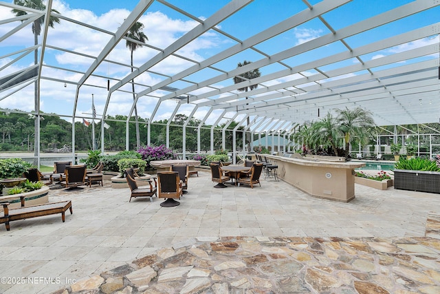 view of patio with outdoor dining space, glass enclosure, and a swimming pool