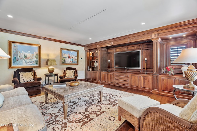 living room with crown molding, light wood-style flooring, and recessed lighting