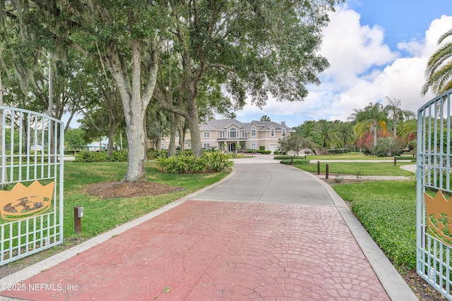 view of home's community with a residential view and a lawn