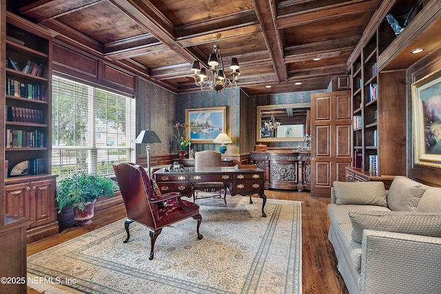 home office with wooden ceiling, wood-type flooring, a chandelier, beam ceiling, and coffered ceiling
