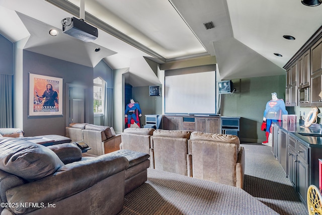 home theater with lofted ceiling and baseboards