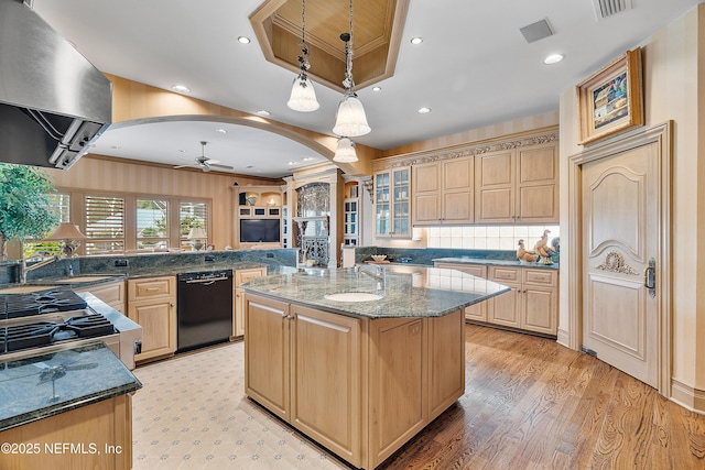 kitchen featuring black dishwasher, exhaust hood, a sink, ceiling fan, and arched walkways