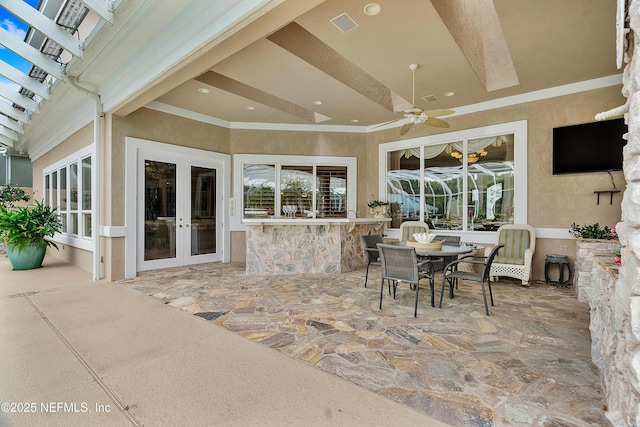 view of patio / terrace with french doors, ceiling fan, and outdoor dining space