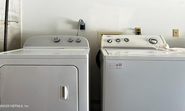 laundry area with laundry area and washer and clothes dryer