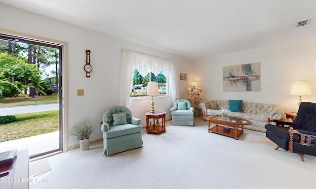 carpeted living room with visible vents