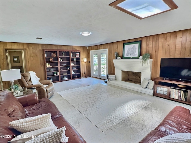 2327 Cheryl Dr, Jacksonville, FL 32217 - living room with wooden walls and a fireplace with raised hearth