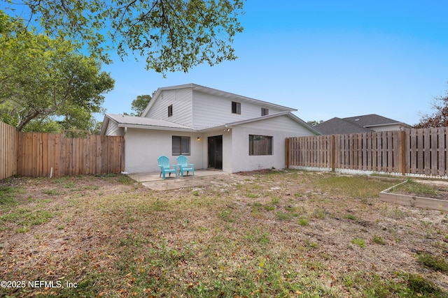 62 Atlantic Oaks Cir, Saint Augustine, FL 32080 - rear view of property featuring a yard, a patio area, a vegetable garden, and a fenced backyard