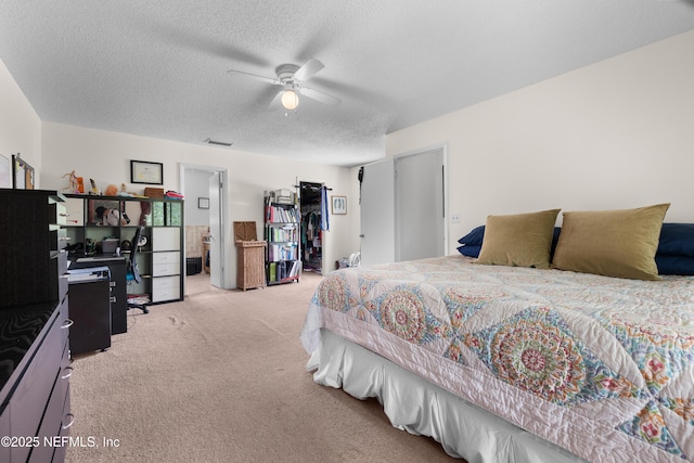 62 Atlantic Oaks Cir, Saint Augustine, FL 32080 - bedroom featuring a textured ceiling, ceiling fan, and light carpet