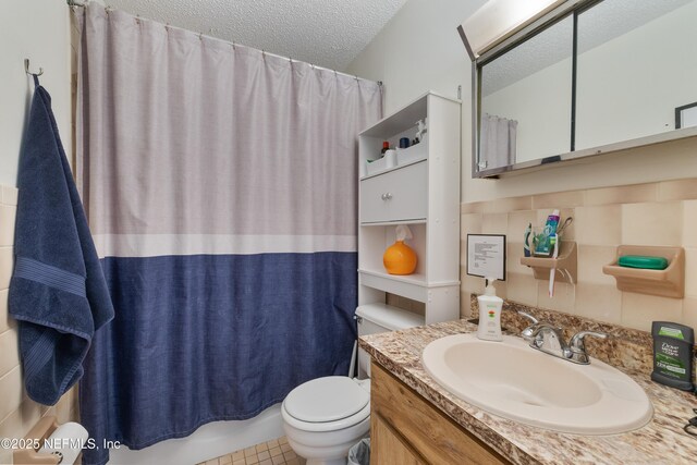 62 Atlantic Oaks Cir, Saint Augustine, FL 32080 - full bathroom with shower / bath combo, toilet, a textured ceiling, and vanity