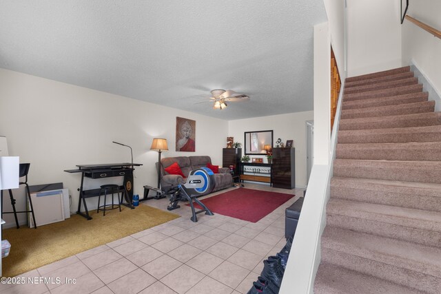 62 Atlantic Oaks Cir, Saint Augustine, FL 32080 - exercise area featuring light tile patterned floors, a ceiling fan, and a textured ceiling