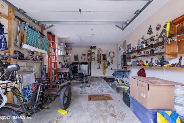 62 Atlantic Oaks Cir, Saint Augustine, FL 32080 - garage with a workshop area and washer / clothes dryer