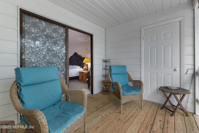 62 Atlantic Oaks Cir, Saint Augustine, FL 32080 - living area with wood walls and light wood-style floors