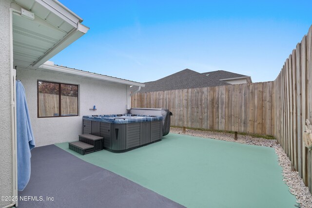 62 Atlantic Oaks Cir, Saint Augustine, FL 32080 - view of patio with a fenced backyard and a hot tub