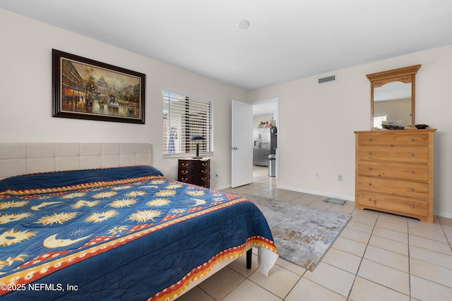62 Atlantic Oaks Cir, Saint Augustine, FL 32080 - bedroom featuring baseboards, visible vents, stainless steel refrigerator with ice dispenser, and light tile patterned flooring