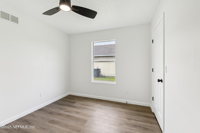 7843 India Ave, Jacksonville, FL 32211 - empty room featuring baseboards, ceiling fan, wood finished floors, and visible vents