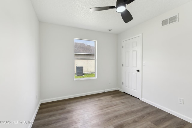 7843 India Ave, Jacksonville, FL 32211 - unfurnished room with visible vents, wood finished floors, baseboards, ceiling fan, and a textured ceiling
