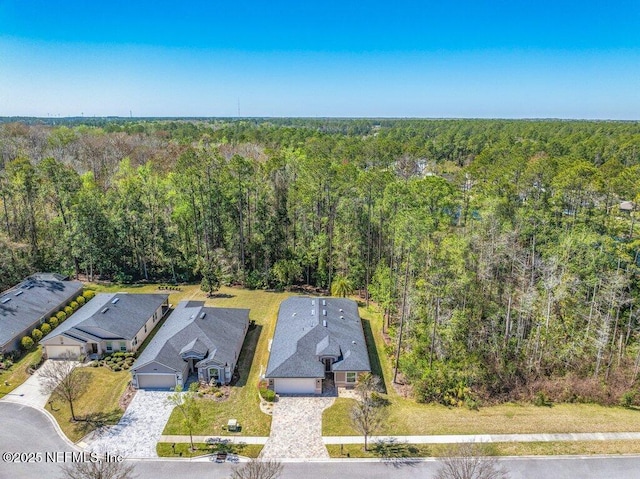 aerial view with a wooded view