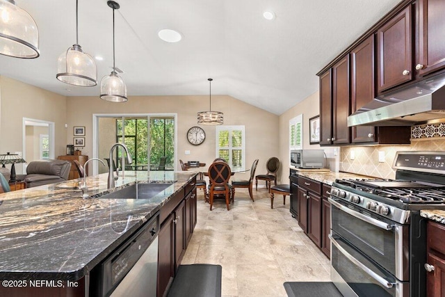 kitchen featuring decorative backsplash, appliances with stainless steel finishes, a sink, lofted ceiling, and under cabinet range hood