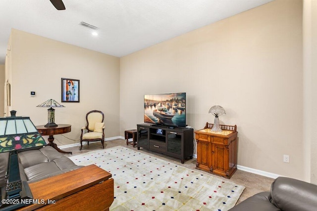 living area featuring visible vents and baseboards