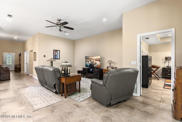 living room featuring light tile patterned floors, a ceiling fan, recessed lighting, and visible vents
