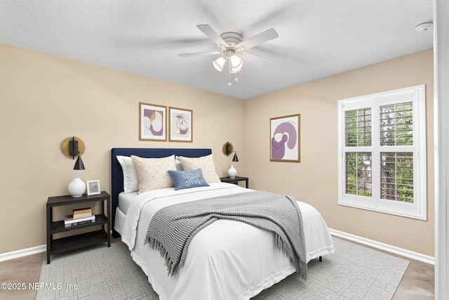 bedroom featuring baseboards and a ceiling fan
