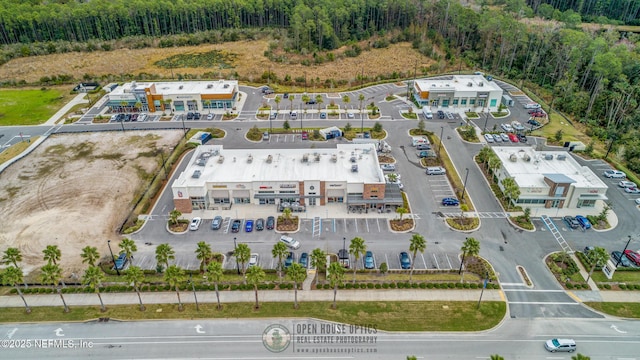 bird's eye view featuring a wooded view
