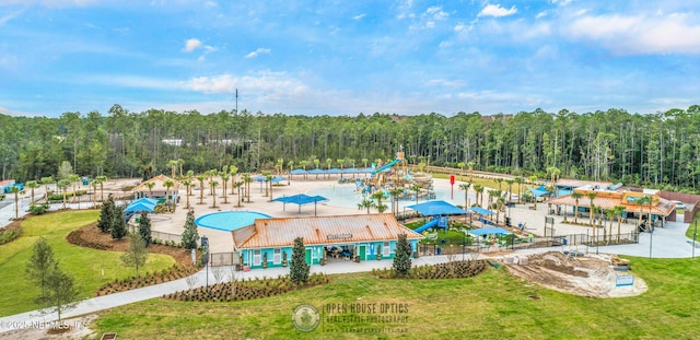 aerial view featuring a wooded view