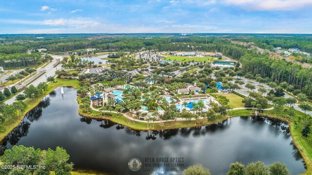 bird's eye view featuring a water view and a view of trees