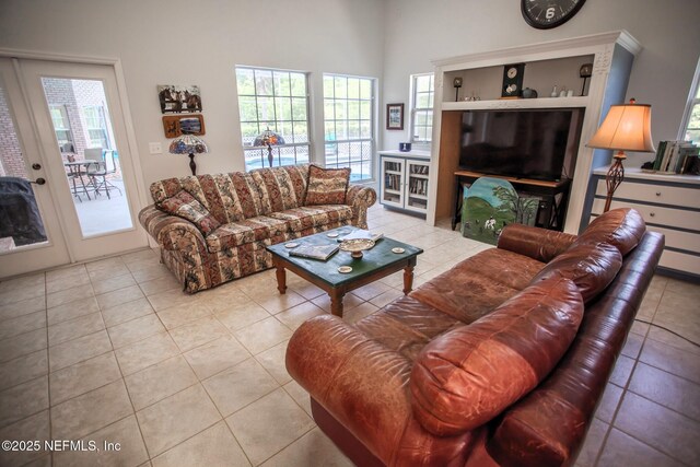 tiled living room featuring a wealth of natural light