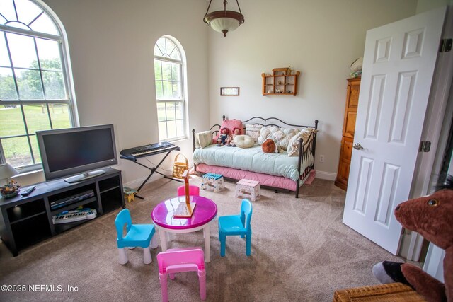 carpeted bedroom with baseboards