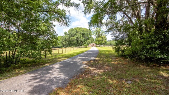 view of road featuring aphalt driveway