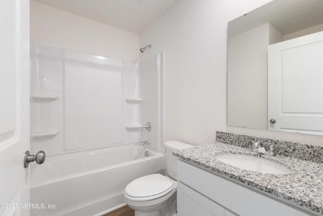 full bath featuring washtub / shower combination, toilet, and vanity