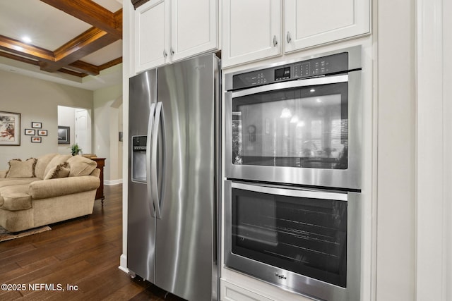 kitchen with stainless steel appliances, open floor plan, white cabinetry, dark wood-type flooring, and coffered ceiling