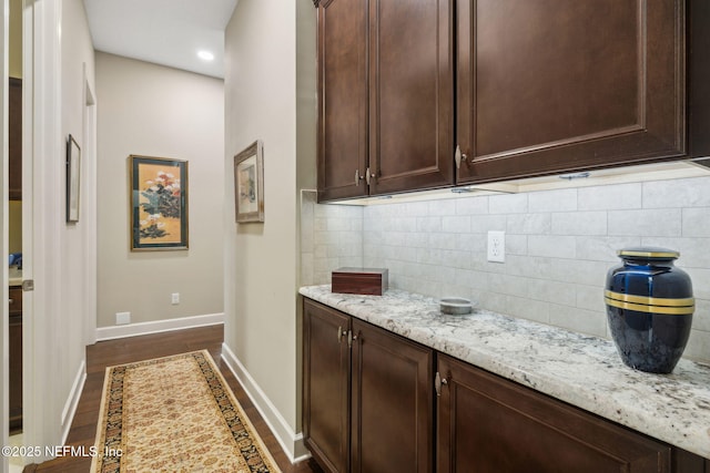 interior space with decorative backsplash, recessed lighting, baseboards, and dark wood-style floors