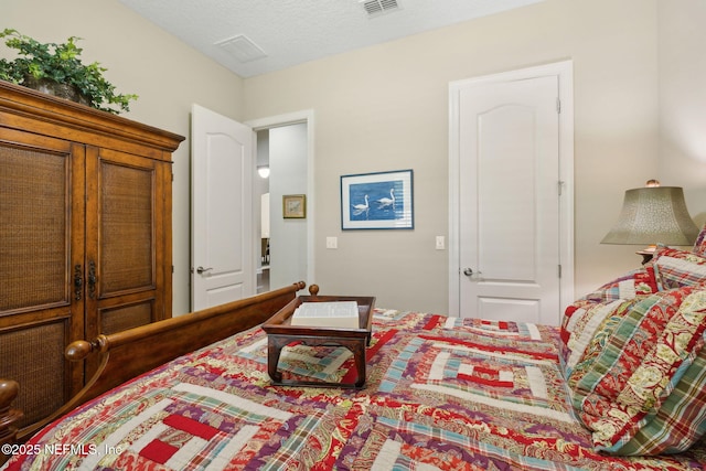 bedroom with visible vents