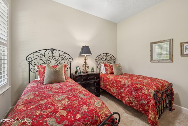 carpeted bedroom with baseboards