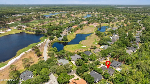 birds eye view of property with a water view, view of golf course, and a residential view