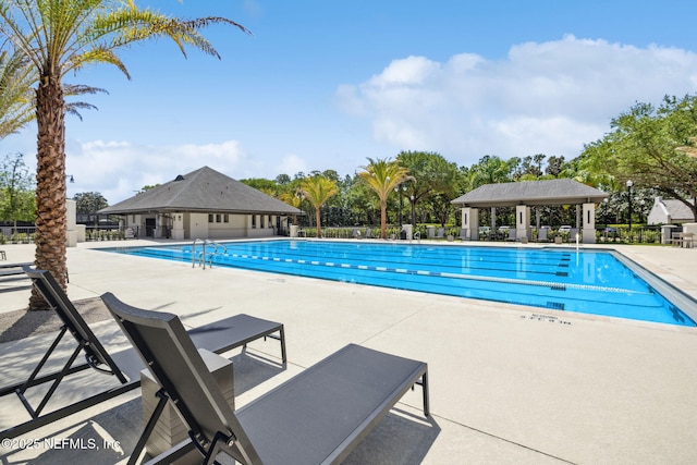 4583 Swilcan Bridge Ln N, Jacksonville, FL 32224 - community pool with fence and a patio area