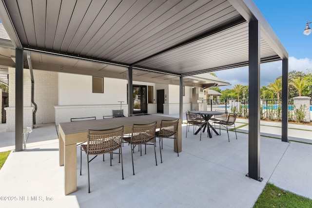 4583 Swilcan Bridge Ln N, Jacksonville, FL 32224 - view of patio featuring outdoor dining area and fence