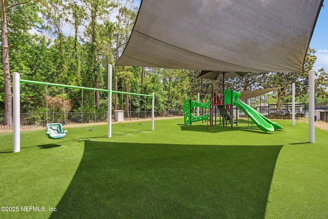 4583 Swilcan Bridge Ln N, Jacksonville, FL 32224 - community jungle gym with fence and a yard