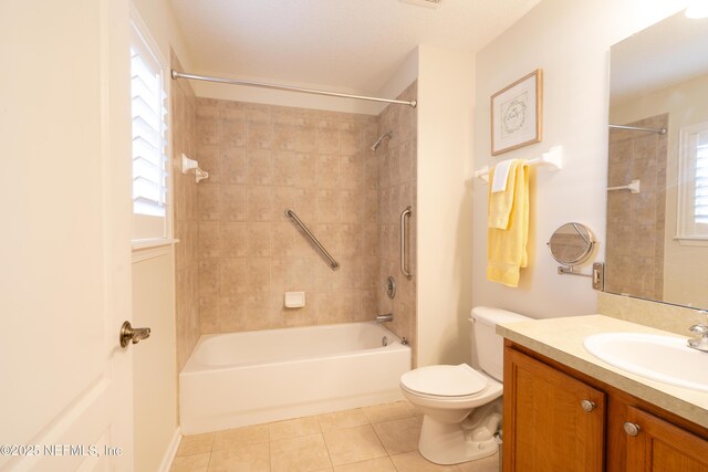 bathroom with tile patterned flooring, bathtub / shower combination, toilet, and vanity