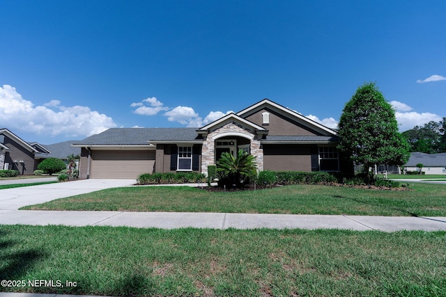 single story home featuring an attached garage, stone siding, stucco siding, a front yard, and driveway