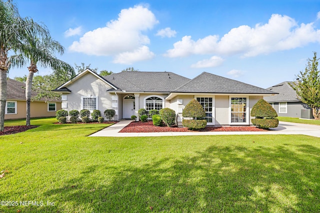 245 Village Green Ave, Fruit Cove, FL 32259 - view of front facade with a shingled roof, a front yard, central air condition unit, and stucco siding