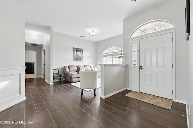 245 Village Green Ave, Fruit Cove, FL 32259 - foyer with baseboards, visible vents, and dark wood-type flooring